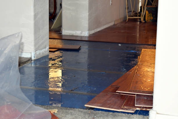 Professional Flood Damage Restoration technician working in North Kingstown, RI